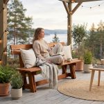 Brown wooden garden bench “Riva” with backrest for terrace use.